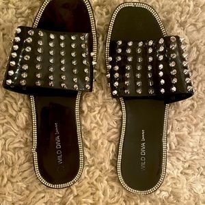Black spiked slip on sandals